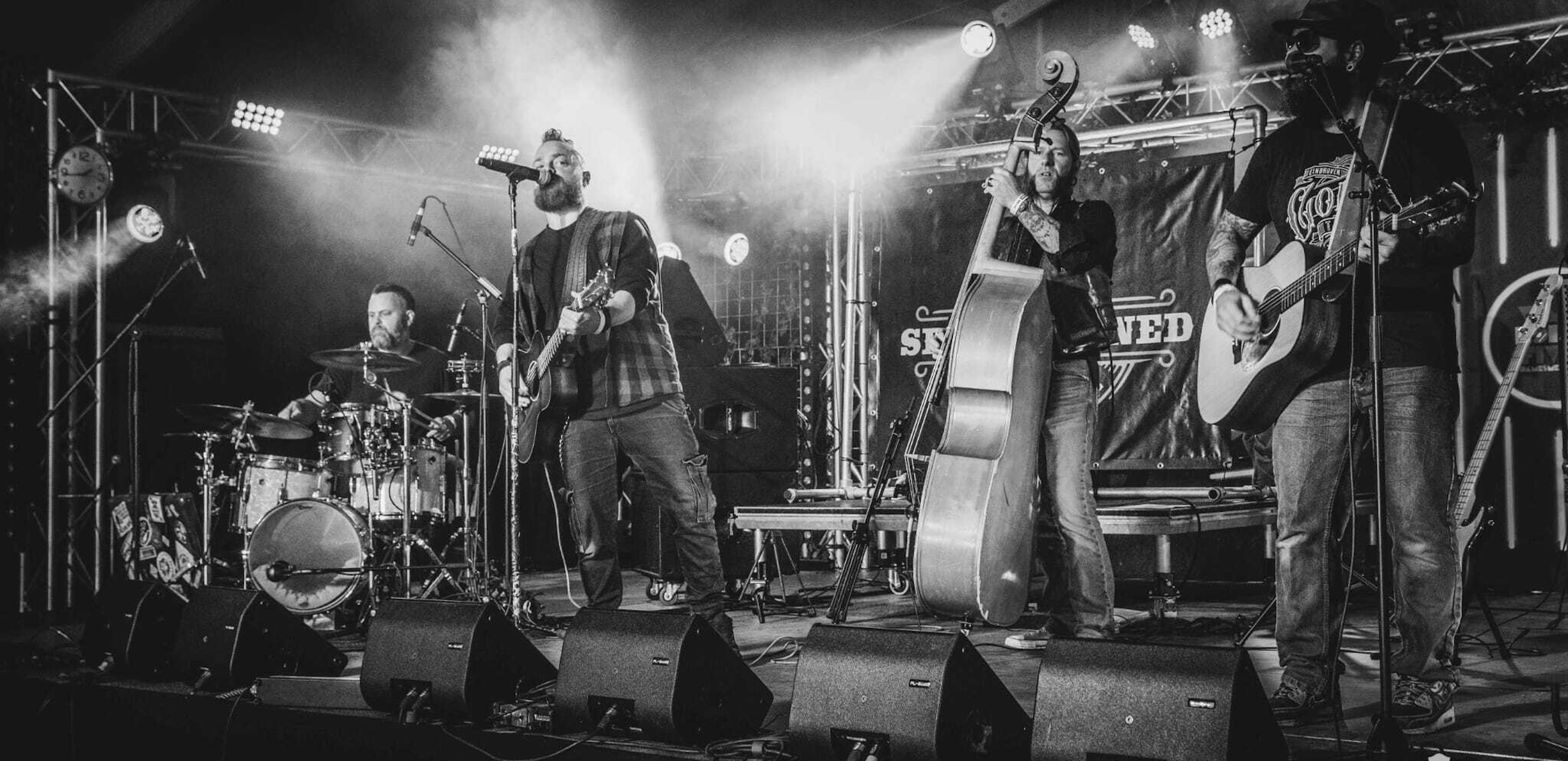 Persfoto 4 voltallige band